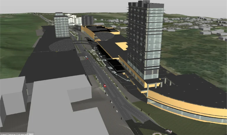 Modelo 3D de una zona urbana con altos edificios modernos, el Centro Comercial Punto Sur, una carretera de varios carriles con coches y zonas verdes al fondo, vista desde una perspectiva elevada