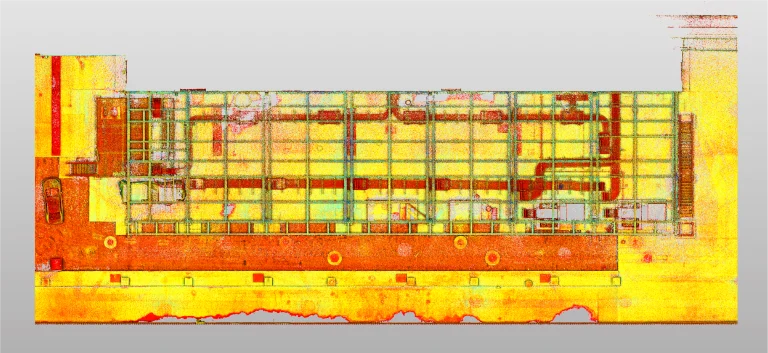 Escaneo de arriba abajo y codificado por colores de una planta rectangular de la Bodega, en el que se muestran las líneas de cuadrícula, las salas y los detalles estructurales en tonos amarillos, rojos y verdes. Se aprecian algunas máquinas y caminos
