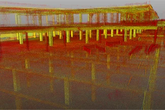 Nube de puntos del Centro Comercial Punto Sur en construcción, con puntos de datos coloreados que representan columnas estructurales, vigas y suelos en tonos amarillos y rojos.