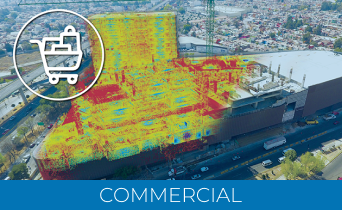 A large commercial building, highlighted with a thermal or Laser Scanner for Construction scan in red, yellow, and blue, sits by a busy road. An icon of a shopping cart is in the top left corner. The word COMMERCIAL is at the bottom.
