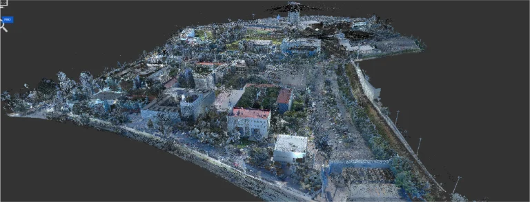 Una nube de puntos digital en 3D del Tecnológico de Monterrey con varios edificios, carreteras y zonas verdes vista desde una perspectiva aérea angular