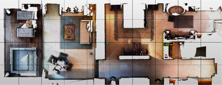 Plano de planta escaneado en color, de arriba abajo, creado con Escaneo Láser, que muestra habitaciones amuebladas, incluidos un dormitorio, una sala de estar, un comedor, un cuarto de baño y pasillos, con una línea de medición amarilla que indica 2,422 metros en una zona