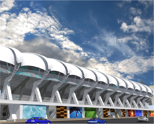 Modelo BIM del estadio Pascual Guerrero, un estadio moderno con un exterior blanco curvado y paneles de colores a lo largo del nivel inferior, se alza sobre un cielo parcialmente nublado. Dos coches azules y uno gris están aparcados frente al edificio