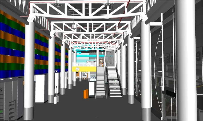 Modelo BIM de un espacioso y moderno atrio interior -como los del Aeropuerto Internacional de Guadalajara- con altas columnas blancas, vigas vistas, una escalera central y coloridos paneles murales. Los escaparates y la señalización son visibles en todo el edificio