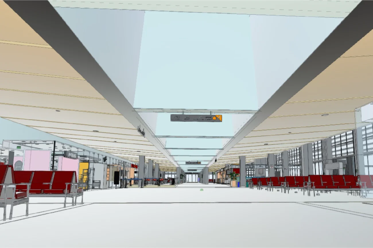 Una terminal espaciosa y moderna en el Aeropuerto Internacional de Tijuana cuenta con filas de asientos rojos, amplios ventanales y un techo alto con claraboyas. Letreros digitales cuelgan en el techo y tiendas se alinean a los lados del pasillo.