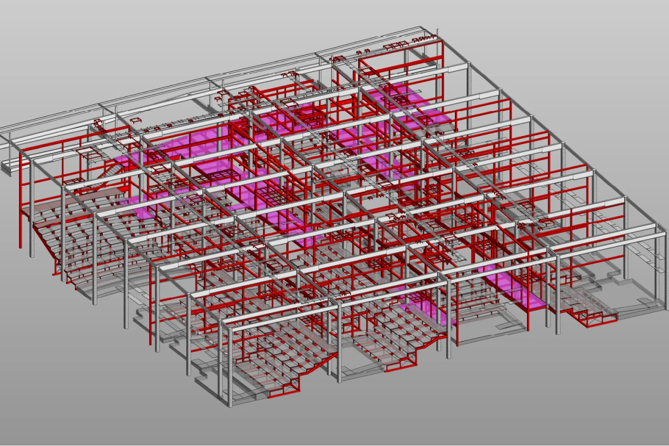 Modelo arquitectónico en 3D que muestra la estructura de un edificio con vigas de acero en rojo, pisos y áreas de asientos (posiblemente representando una sala de cine o auditorio Cinépolis en Mitikah) mostrado sobre un fondo gris claro.