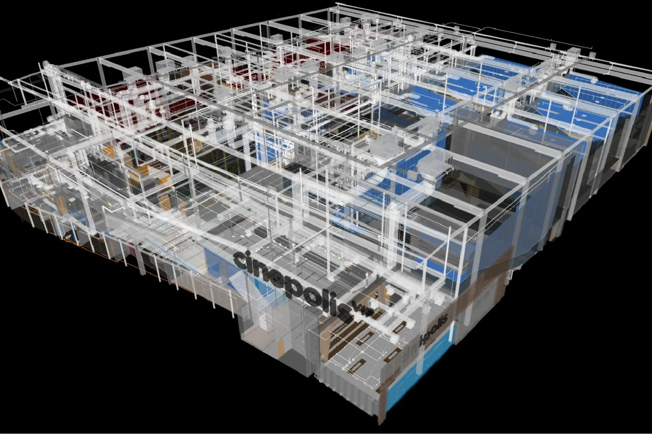 Modelo arquitectónico 3D de un edificio con paredes transparentes y elementos estructurales expuestos, que revela diversas salas e infraestructura. La palabra Cinépolis se ve en un lateral, lo que indica que hay un cine en Mitikah.
