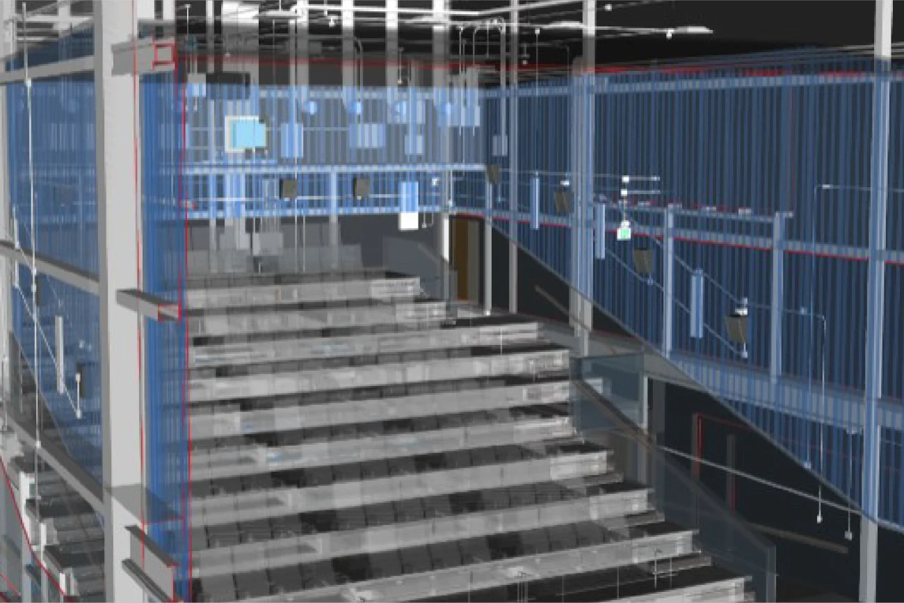 Modelo digital 3D del interior de una sala de cine Cinépolis en Mitikah, que muestra vigas estructurales, escaleras y paredes transparentes que exponen el cableado eléctrico y los sistemas HVAC para fines de diseño o planificación de construcción.