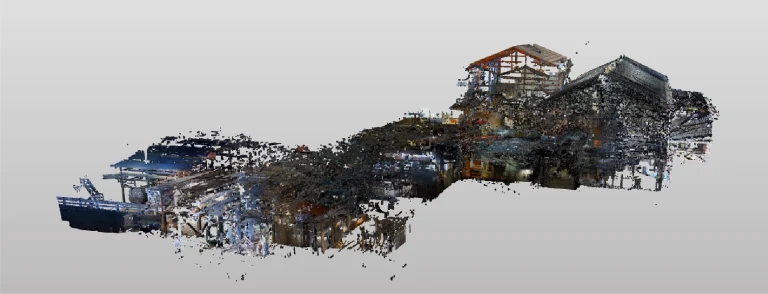 Nube de puntos en 3D del Ingenio Azucarero Tamazula, con puntos de colores dispersos que perfilan y detallan la estructura de la instalación industrial sobre un fondo gris liso