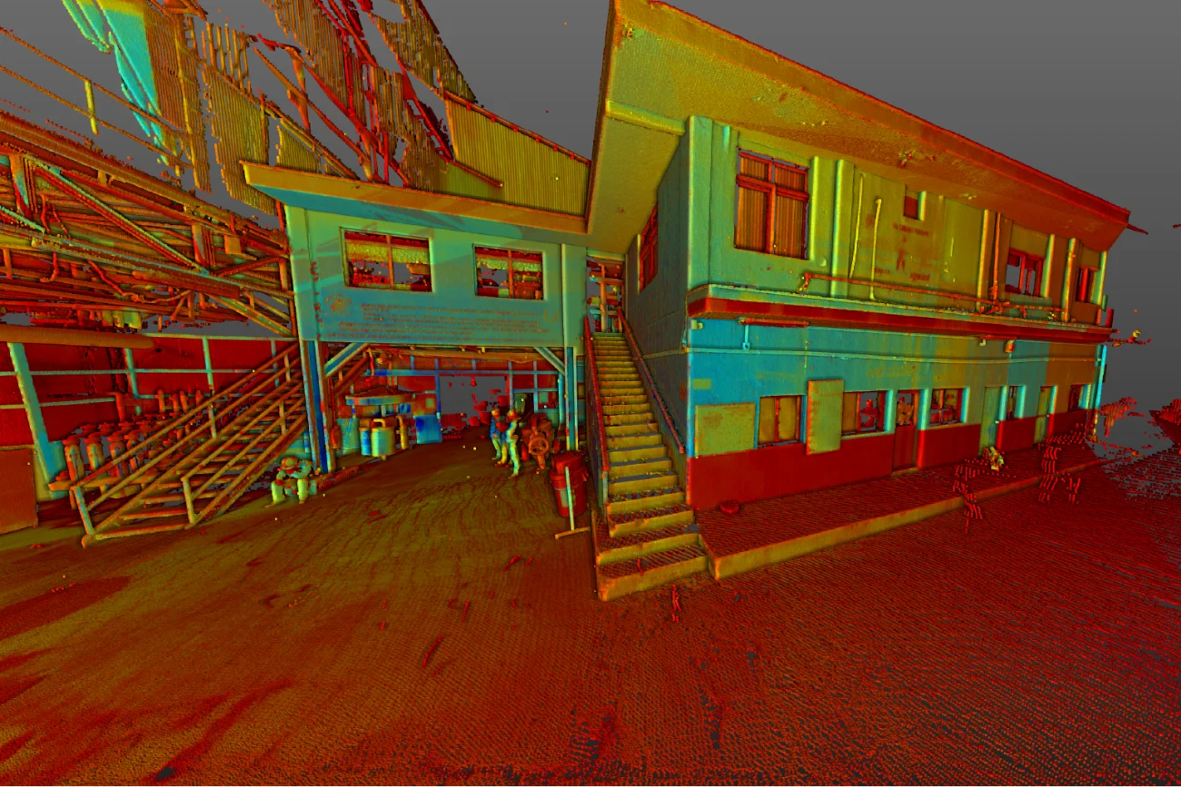 A colorful 3D point cloud scan of the Tamazula Sugar Mill in Jalisco, showing the exterior of a two-story industrial building with stairs, metal pipes, and several people standing on a textured floor, capturing the essence of sugar production.