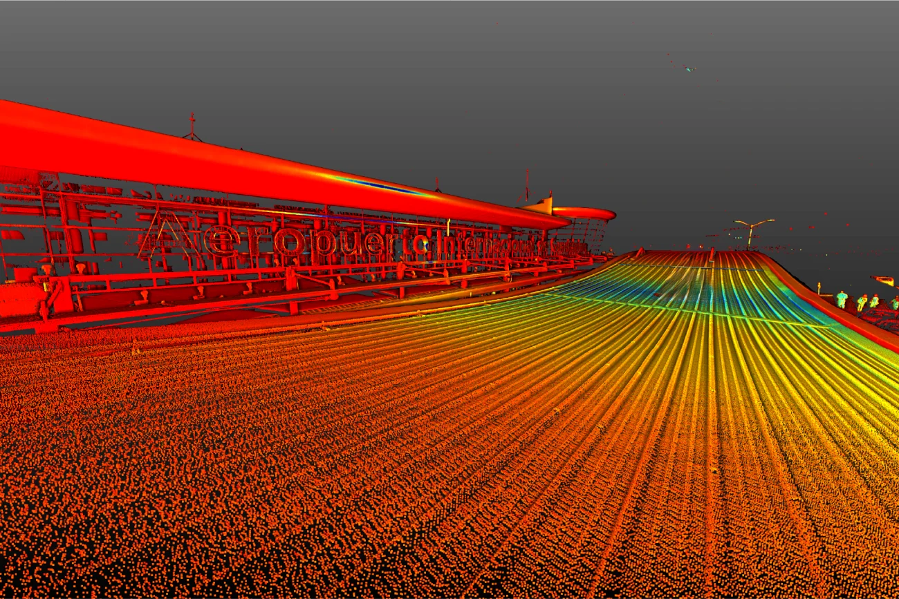Una colorida imagen 3D de un puente cerca del aeropuerto de Guadalajara, con líneas rojas, naranjas, amarillas y verdes que representan la carretera y las barandillas, sobre un cielo gris oscuro.