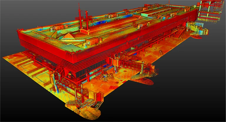 Una colorida nube de puntos en 3D del Aeropuerto Internacional de Tijuana, vista desde un ángulo elevado, que muestra características estructurales detalladas en tonos rojos, amarillos, verdes y azules sobre un fondo oscuro