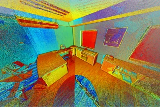 Una colorida y abstracta nube de puntos 3D escaneada de una oficina con un escritorio, una silla, una estantería y obras de arte en la pared. Vibrantes tonos rojos, azules, verdes y amarillos evocan el aspecto de los azulejos de Azulejos a la vez que añaden profundidad y complementos de estilo a todas las superficies.