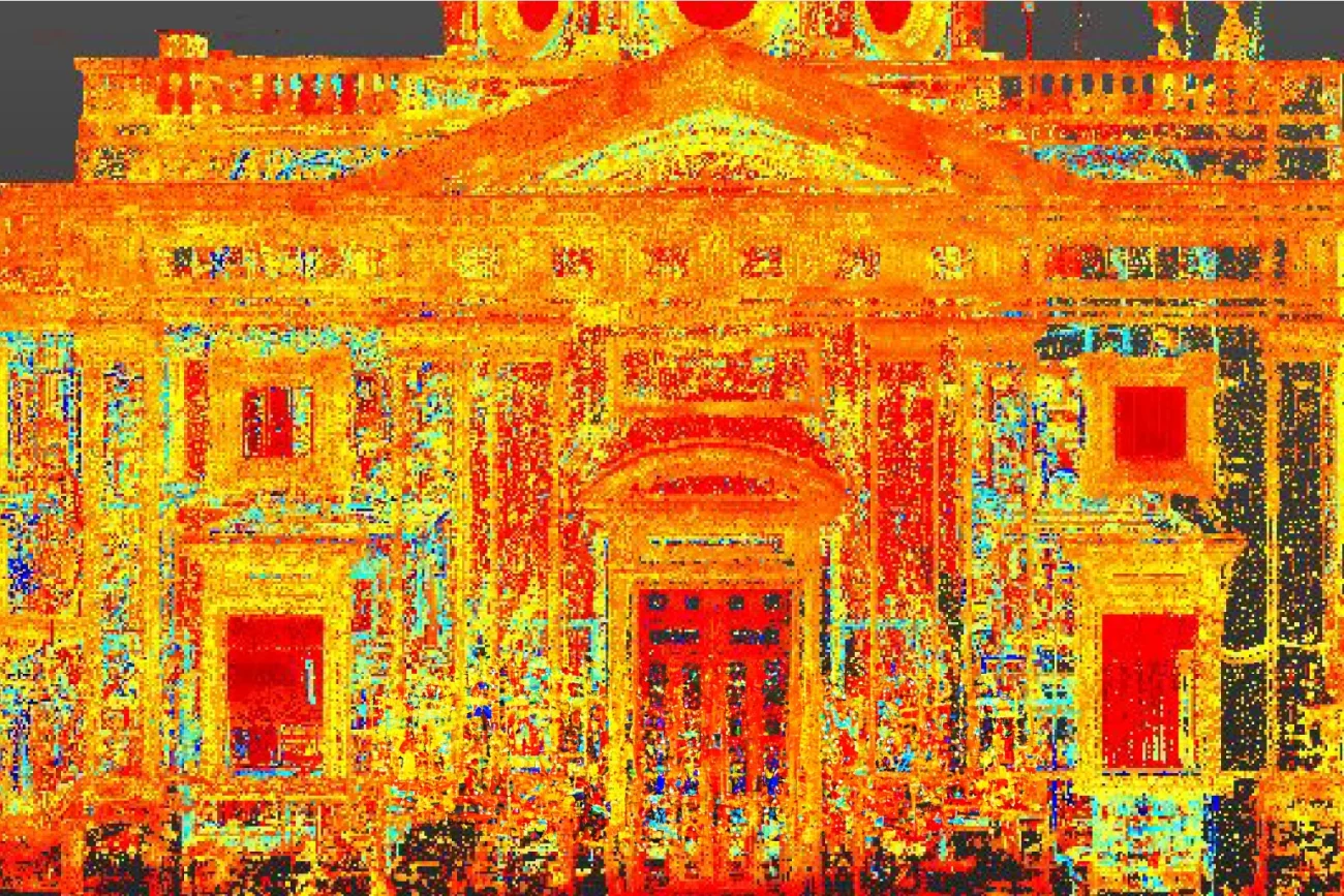 Nube de puntos de la fachada clásica de la Biblioteca Iberoamericana, con vibrantes puntos rojos, amarillos y azules que perfilan detalles arquitectónicos como columnas, ventanas y un frontón triangular.