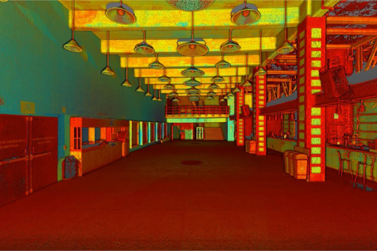 Esta sala de conciertos de Ciudad de México, una gran sala interior con un techo alto e hileras de luces colgantes, se muestra una nube de puntos que resalta diversas superficies en tonos rojos, amarillos, verdes y azules.