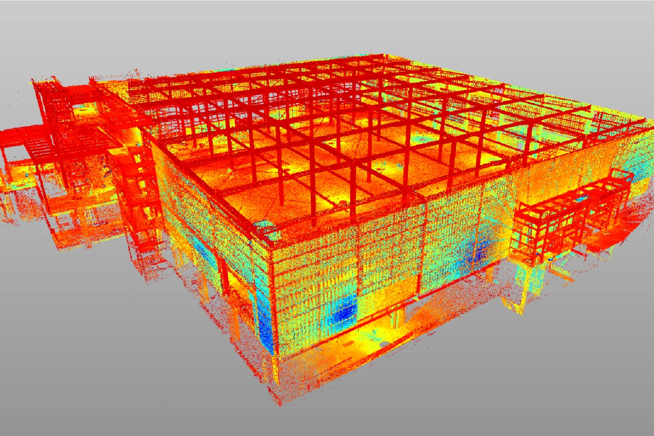 Una nube de puntos en 3D de la Cinépolis Mitikah de Ciudad de México, con colores del rojo al azul que indican diferentes alturas y superficies, destaca el marco y los detalles arquitectónicos de la sala.