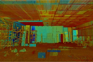 A colorful 3D scanned point cloud of a local indoor construction site, showing structural elements, scaffolding, debris, and an unfinished roof: Beware of Dog signage adds authenticity to the scene.