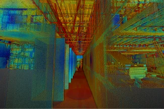 A colorful 3D scanned point cloud of an industrial site by Local Beware of the Dog, showing pipes, beams, and partially built structures along a corridor, with vibrant hues highlighting structural details.