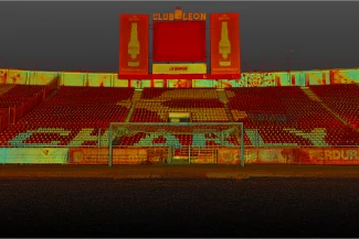 An empty Nou Camp stadium, with red seats, a large scoreboard reading "Club León," and a goal in the foreground. The word "CHARLY" is visible on the lower seats.