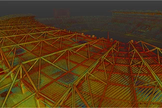 Aerial view of the Nou Camp Stadium with a large geometric metal roof; the image is color-filtered in shades of red, yellow, and green to achieve a stylized and abstract look. The stands and pitch can be seen in the background.