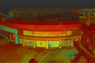 View of the entrance to León Stadium with a red sign displaying its name. Below, a yellow banner reads: "Violence prevention is practiced on every field."