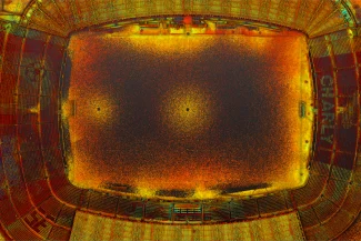 Aerial point cloud of the Nou Camp Stadium, with bright orange, yellow, and red dots highlighting the pitch and seating areas; the word "CHARLY" is visible on the right-hand seats.