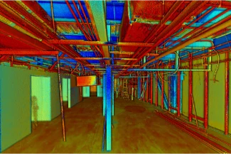 Colorized point cloud image of the unfinished interior of the ISSSTE León Medical Center, showing exposed pipes and beams in the ceiling and partially constructed walls on both sides of a hallway.