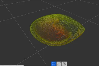 A 3D scanned point cloud of a bowl-shaped object, inspired by Grupo Corona's bathroom furniture, is displayed on a black background, with colors ranging from yellow to red. The object is intersected by grid lines, and tool icons appear on the sides.