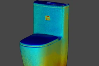 3D scan of a toilet with a rectangular tank and closed lid, in blue, yellow, and green on a dark gray background: an innovative bathroom furniture design from Grupo Corona.