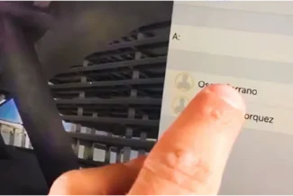 A hand rests on a laptop keyboard. The screen displays a 3D architectural design of the Sentura Tlalnepantla Shopping Center, with a pop-up window showing a profile picture, Alejandro Núñez's name, and a timestamp.