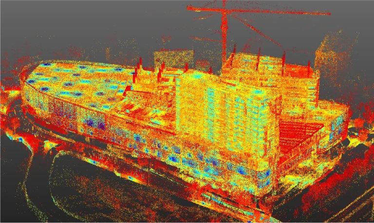 Point cloud image of Sentura Shopping Center in Tlalnepantla under construction, shown in vibrant red, yellow, orange, and blue dots, with cranes visible above the urban building complex