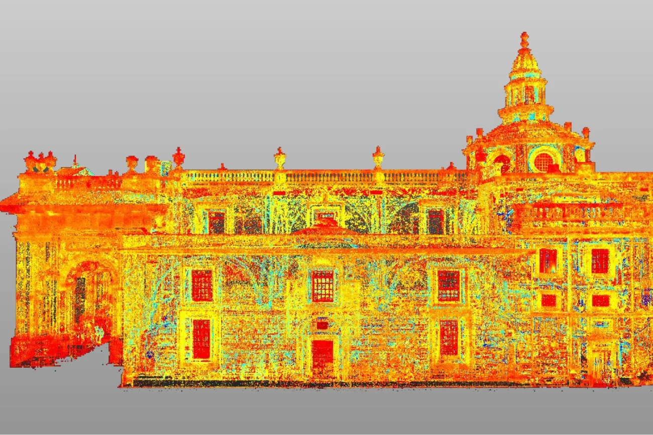 A colorful 3D point cloud scan of the historic Ibero-American Library, featuring a central dome and detailed facade, shown in vibrant red, yellow, green, and blue against a gray gradient background.