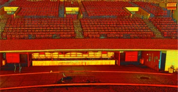 Nube de puntos de un auditorio de teatro vacío con filas de asientos rojos, un escenario en primer plano y una zona de vestíbulo al fondo. El aspecto abstracto y granulado evoca la estética de Escaneo LiDAR CDMX.